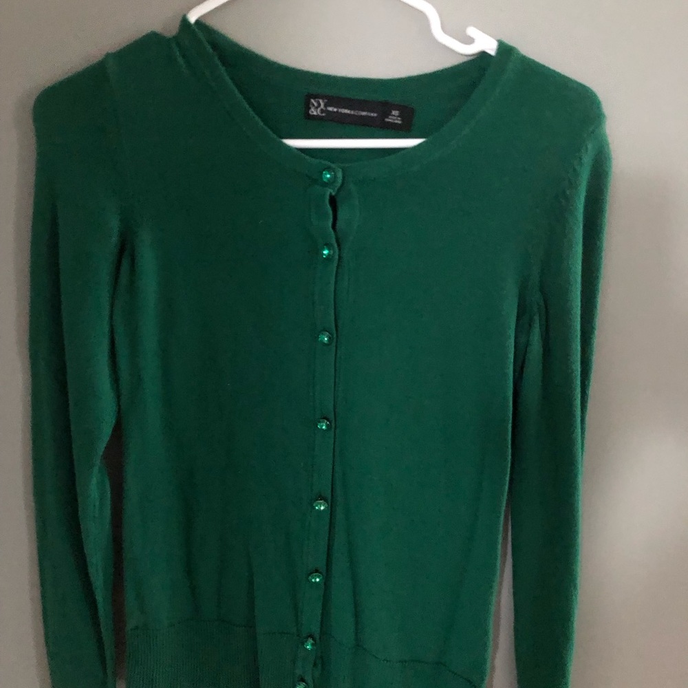 Green sweater.